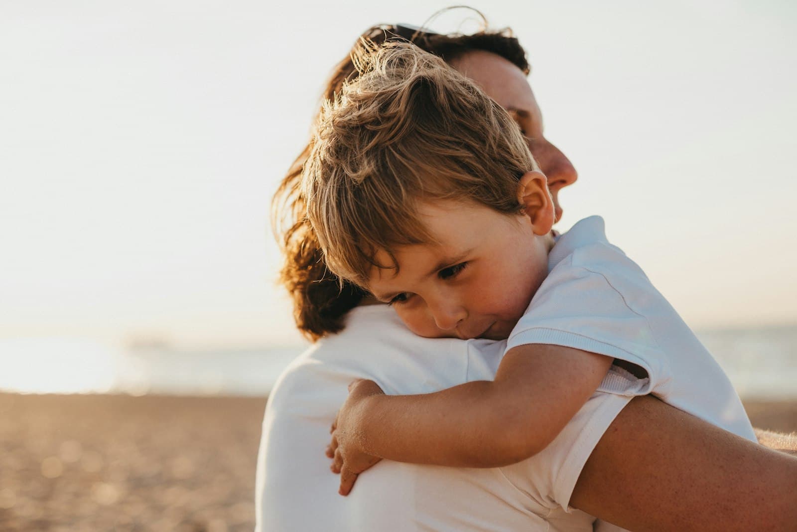 A child hugging a parent